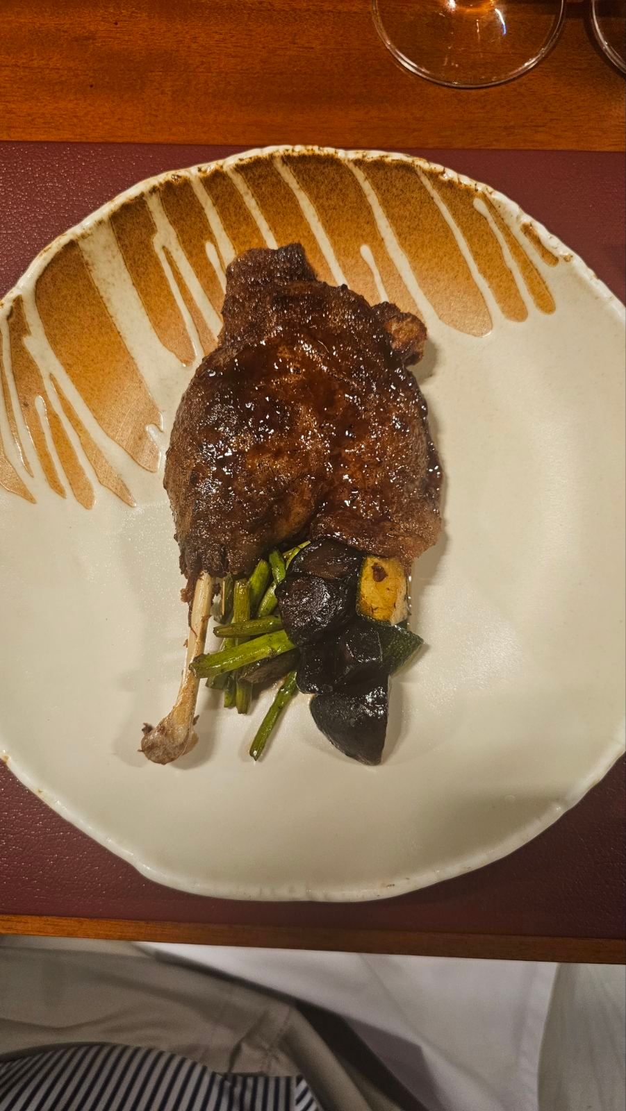 Goxo duck leg with asparagus zucchini and portobello grilled on charcoal