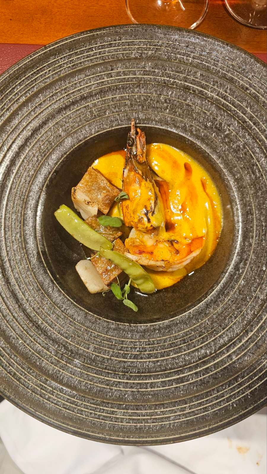 Gambones prawn with scallop potato pumpkin and bravas oil at Goxo